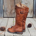 Women's black casual high leg boots with a chunky low heel and round toe on a plain background