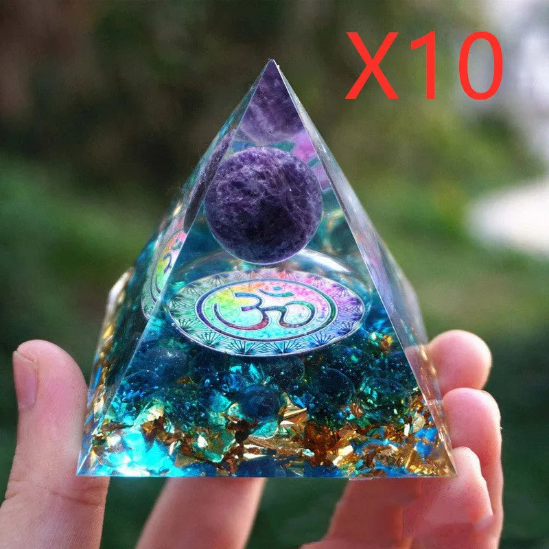 Clear epoxy resin pyramid ornament with embedded blue lapis lazuli crystal gravel, 6cm tall.