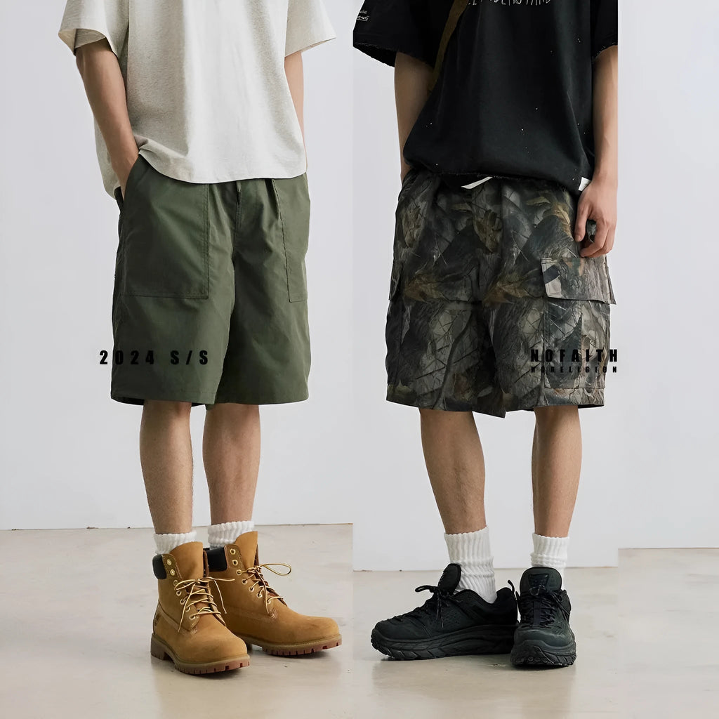 Man wearing loose straight-leg denim shorts in army green, showing mid waist and casual style.