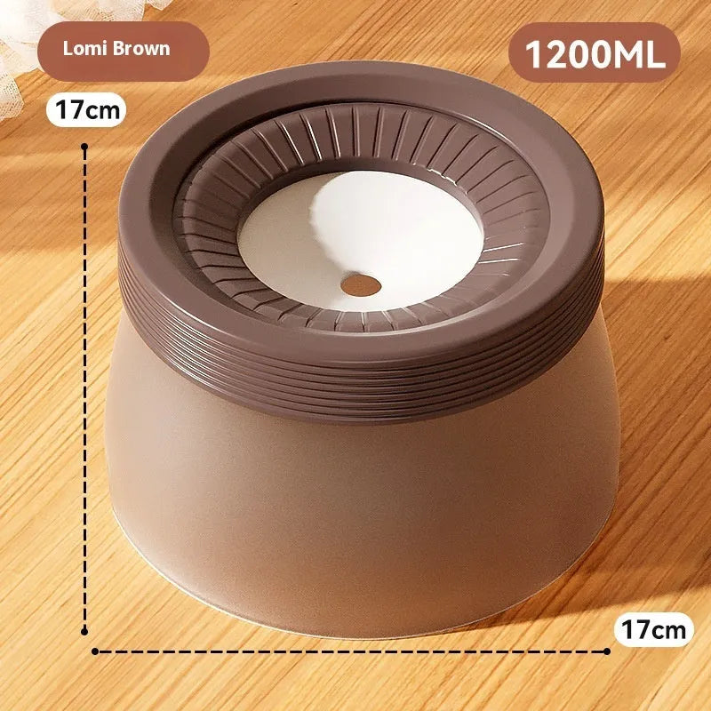 Green raised suspension water bowl for a dog on a white plate