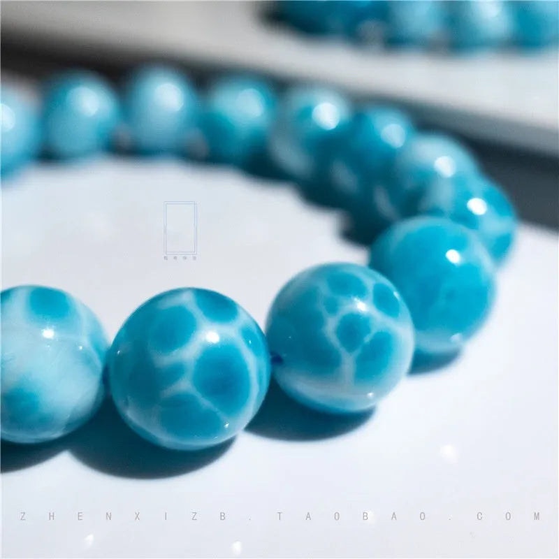 Blue bodhi bracelet with natural crystal sea-pattern stone and pearl accents in Maillard style arrangement
