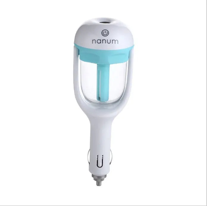 Compact blue car humidifier with rotating nozzle on car dashboard
