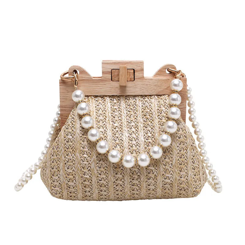 Women's woven straw shoulder bag with pearl chain strap in horizontal square shape