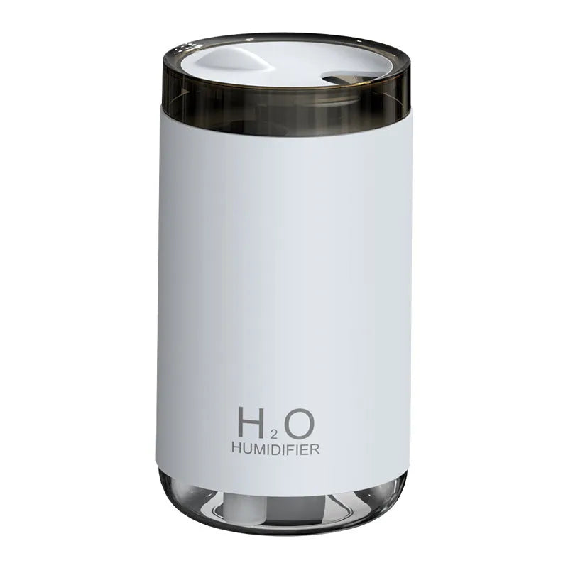 Jellyfish-shaped humidifier emitting smoke ring mist patterns with warm night light glow