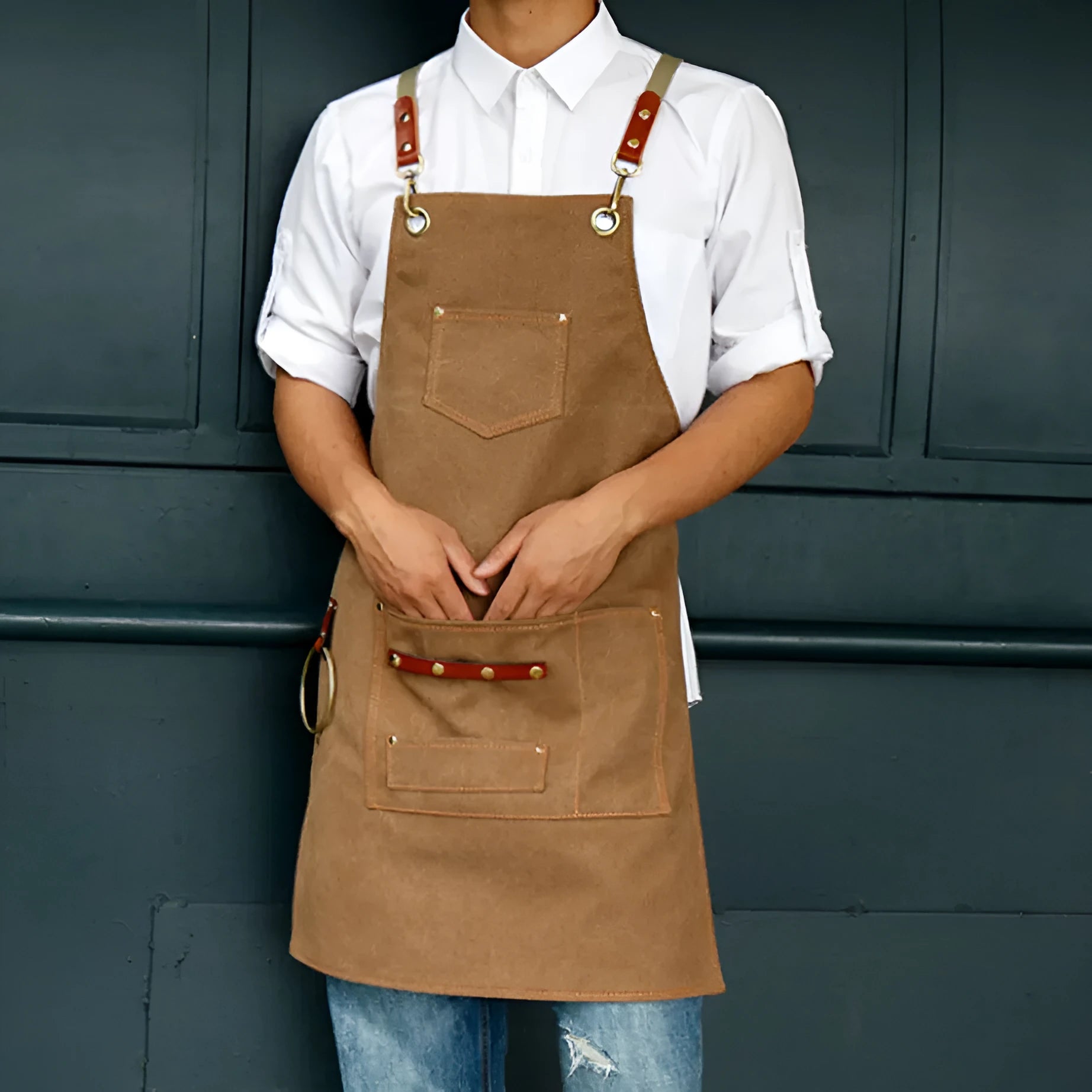 Canvas apron with cross-back straps in camel colour for cafe or baking work