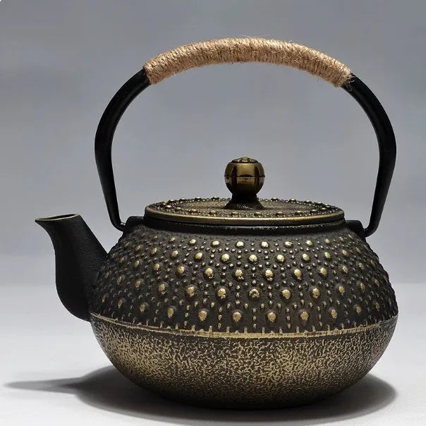 Japanese style cast iron teapot with traditional design and 0.9L capacity for tea brewing