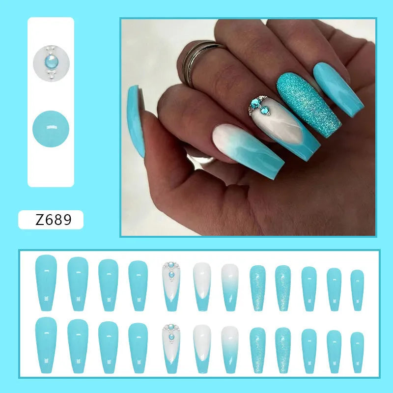 Solid colour long ballet false nails with blue diamond glitter accents and adhesive glue