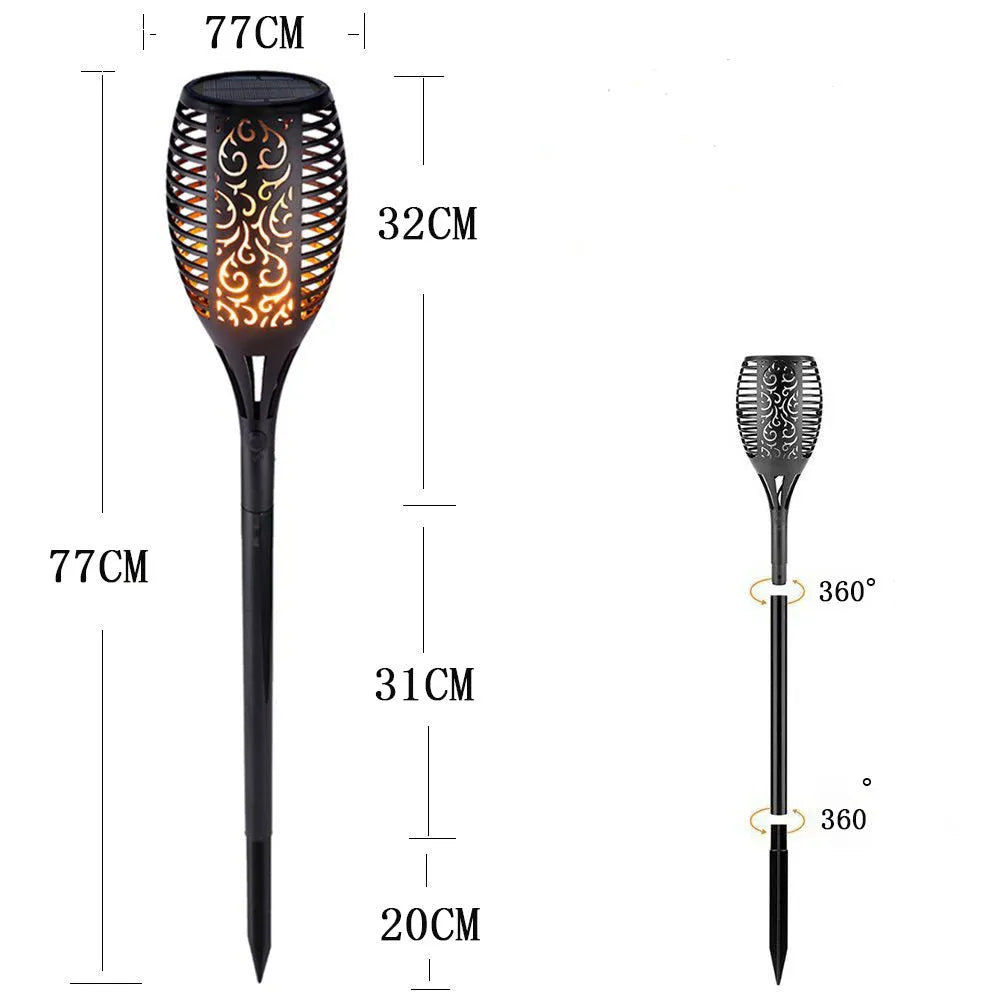 83cm tall black solar flame flickering lawn lamp with warm white LED dancing flame effect on grass