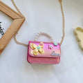 Children's small PU leather shoulder bag with letter print in rose red, showing zipper closure and multiple internal slots