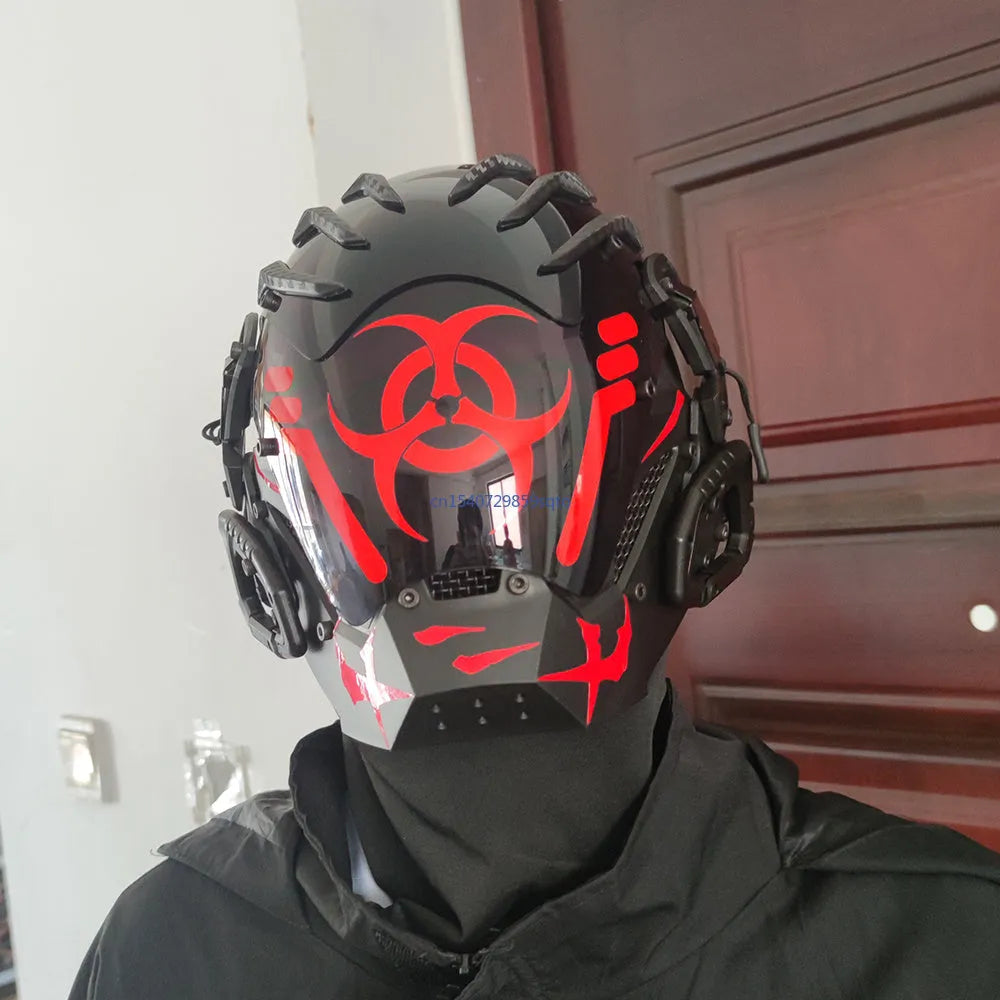 Black full-face cybernetic prop helmet with sci-fi design on a model or stand.