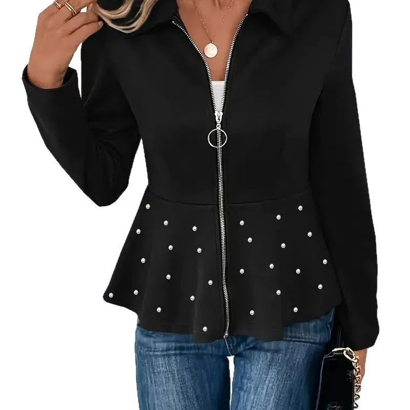 Women's loose fit black coat with a beaded zipper and ruffled hem detail on mannequin.