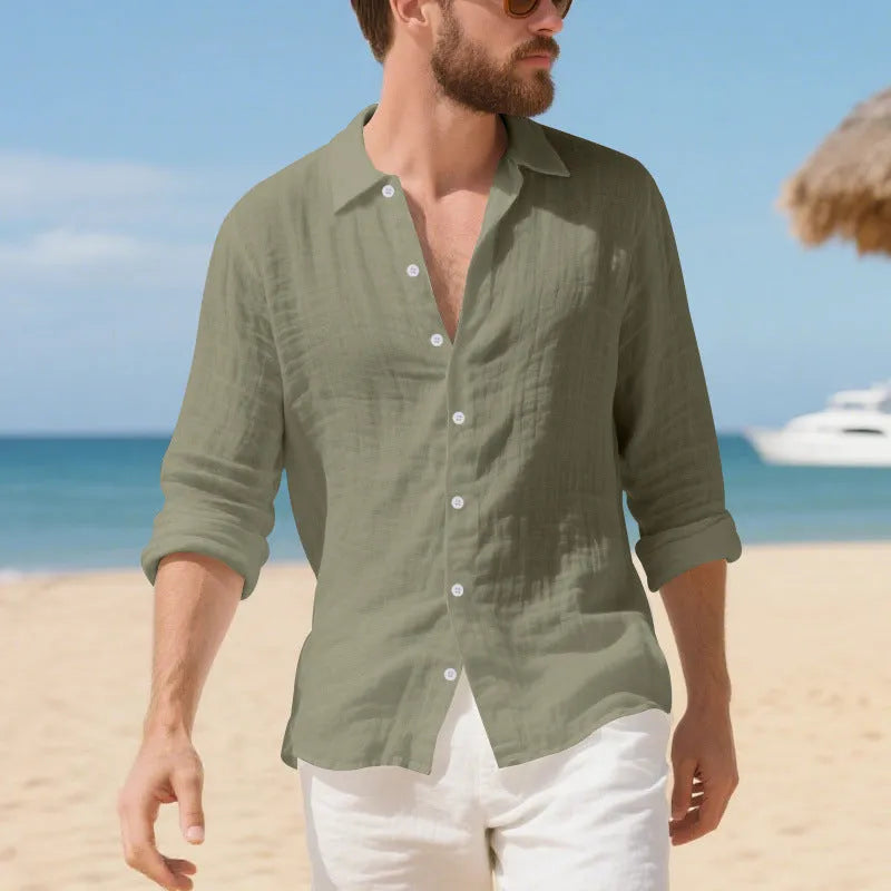 Men's loose fit linen Hawaiian casual shirt on a hanger, shown in light blue colour.
