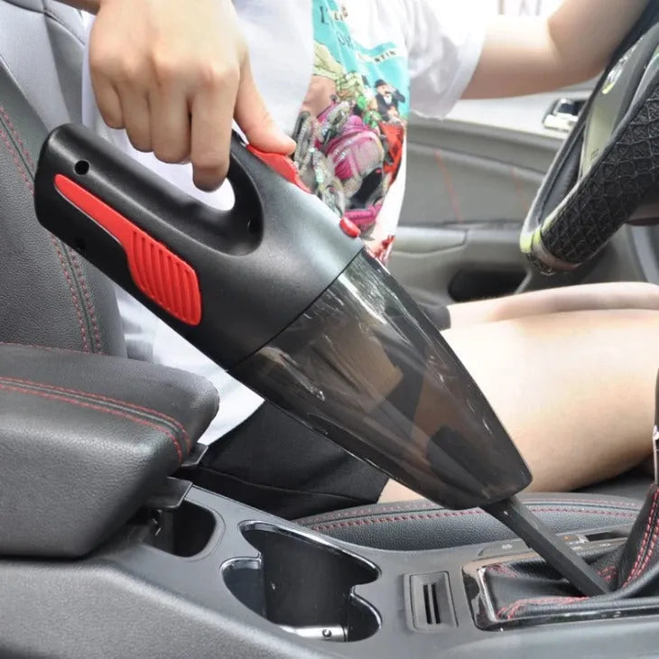 Handheld 120W car vacuum cleaner with brush and long nozzle, black wired model, on car seat