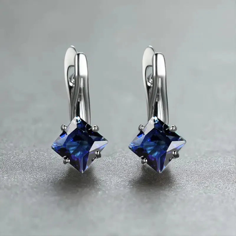 Women's copper earrings with diamond design and inlaid blue zircon stones
