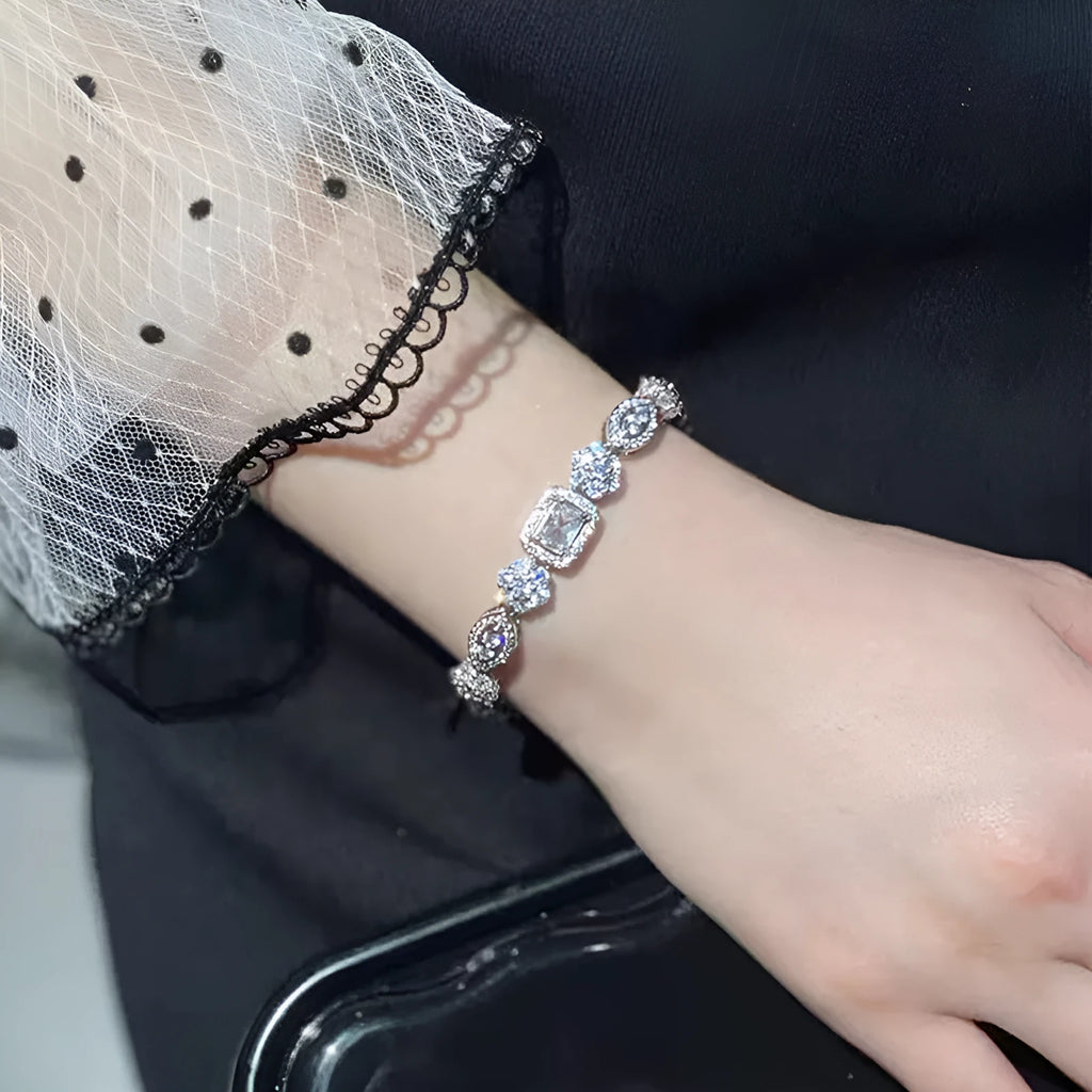 Women's sterling silver-plated bracelet with white gold finish and inlaid zircon stones.
