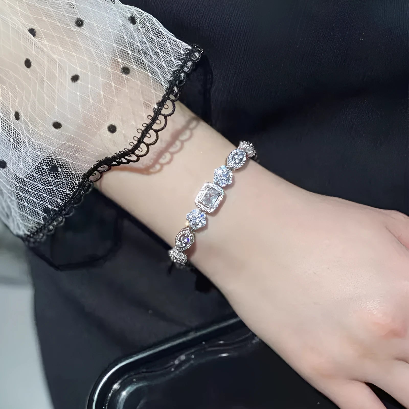 Women's sterling silver-plated bracelet with white gold finish and inlaid zircon stones.