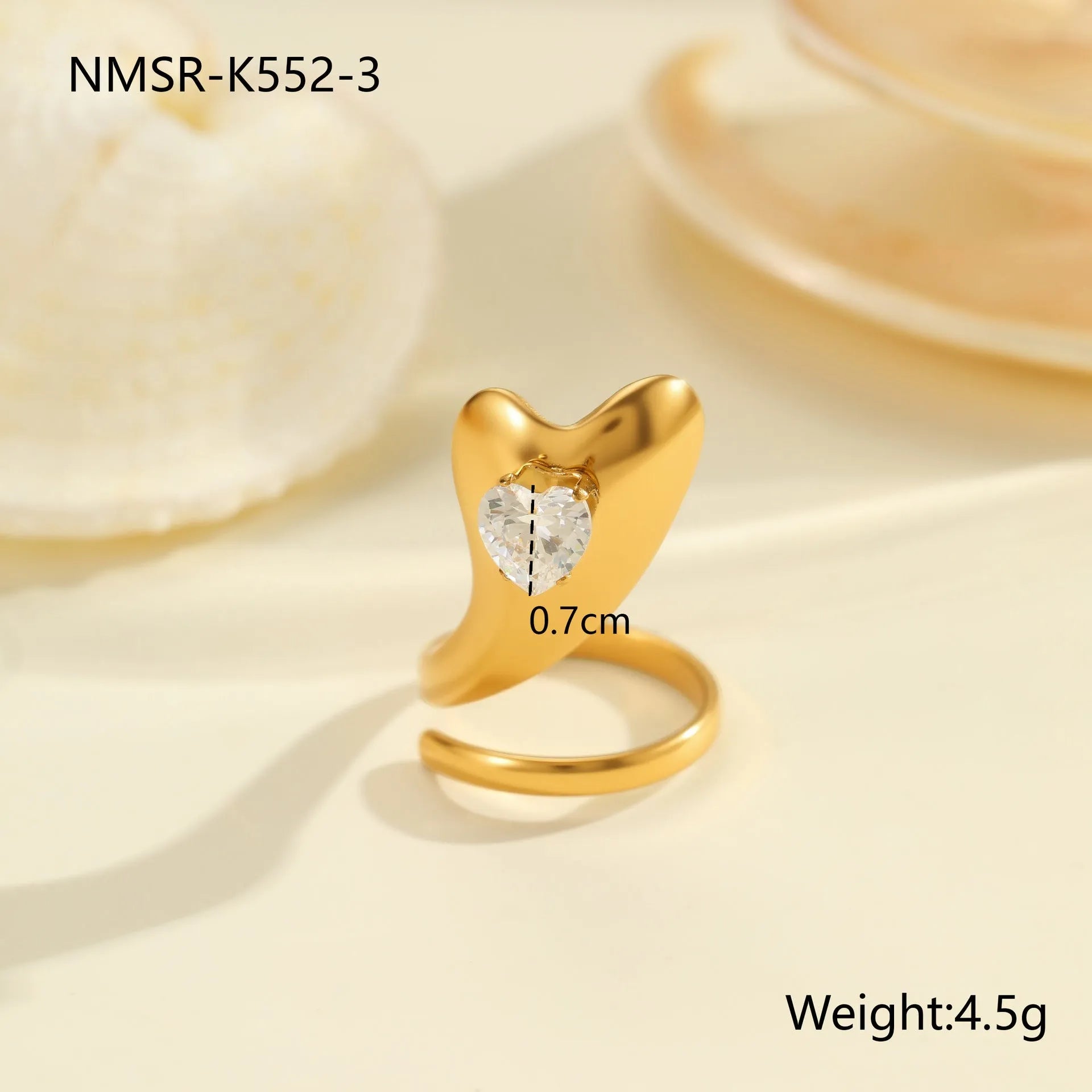 Adjustable geometric stainless steel ring showing open mouth design and colour variations