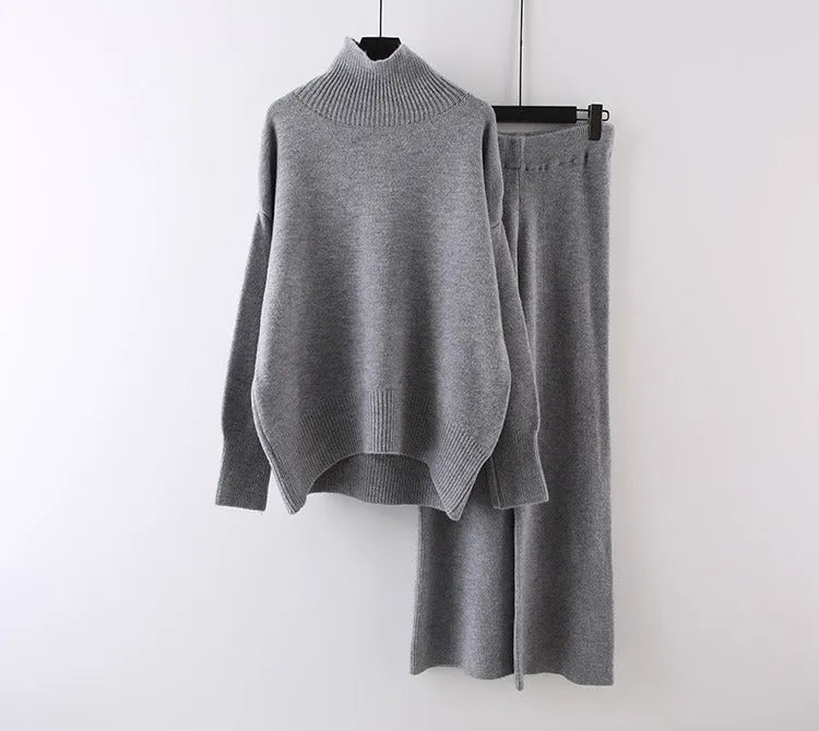 Women's casual two-piece set showing sweater and wide leg trousers in solid colour with thread detail