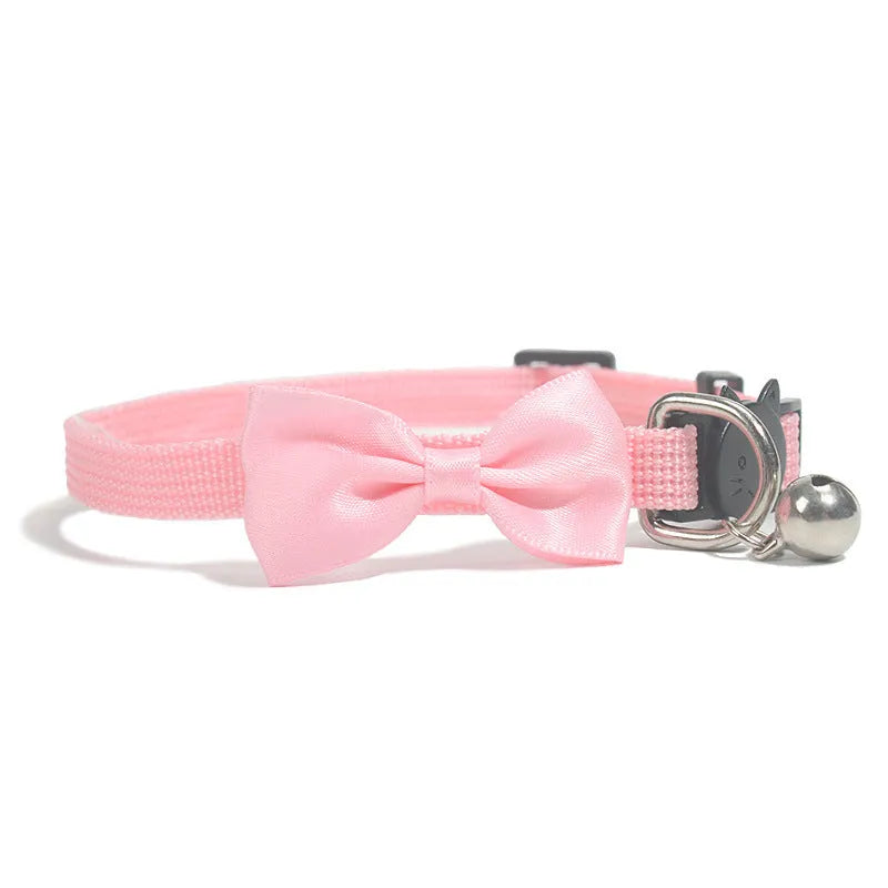 Striped multi-colour adjustable nylon cat collar with a small bell attached.