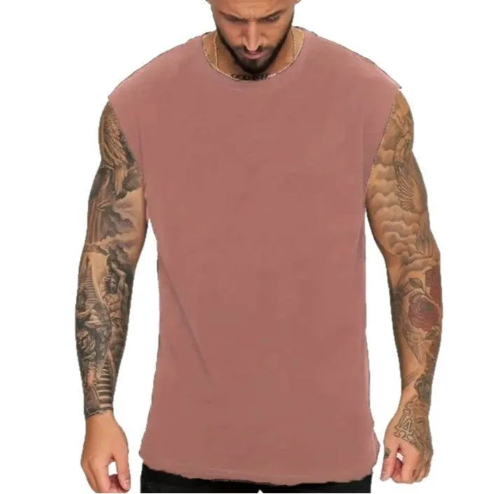 Men's loose-fitting solid colour cotton tank top on a hanger, shown in a light colour.