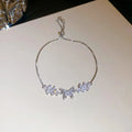 Flower butterfly pendant bracelet for women, copper inlaid zircon, gold finish on white background