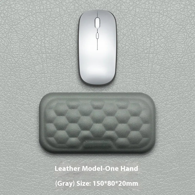 Memory foam mouse wrist rest with silicone base in black cloth and grey leather style options.