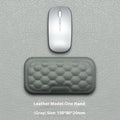 Memory foam mouse wrist rest with silicone base in black cloth and grey leather style options.
