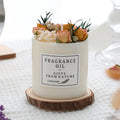 Aromatherapy candle with dried flowers decoration showing approximately 330g size and optional wood chip base