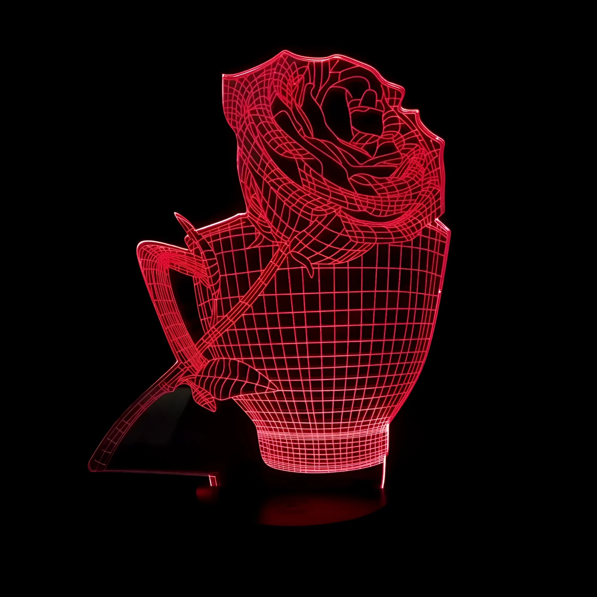 3D acrylic rose flower night light in black finish on a table, showing multicoloured LED illumination.