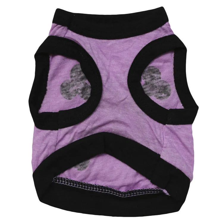 Dog wearing cotton tank top with skull and bones pattern in colour blocking design