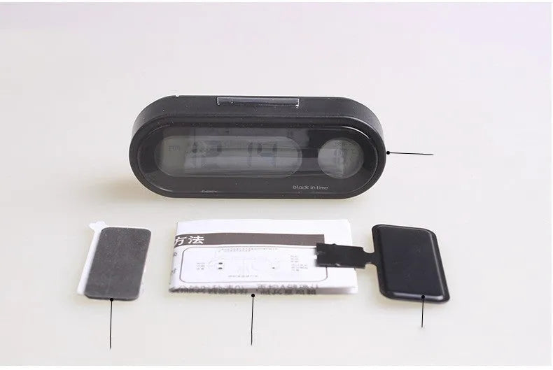 Black car dashboard electronic clock and thermometer with LED display on adjustable bracket