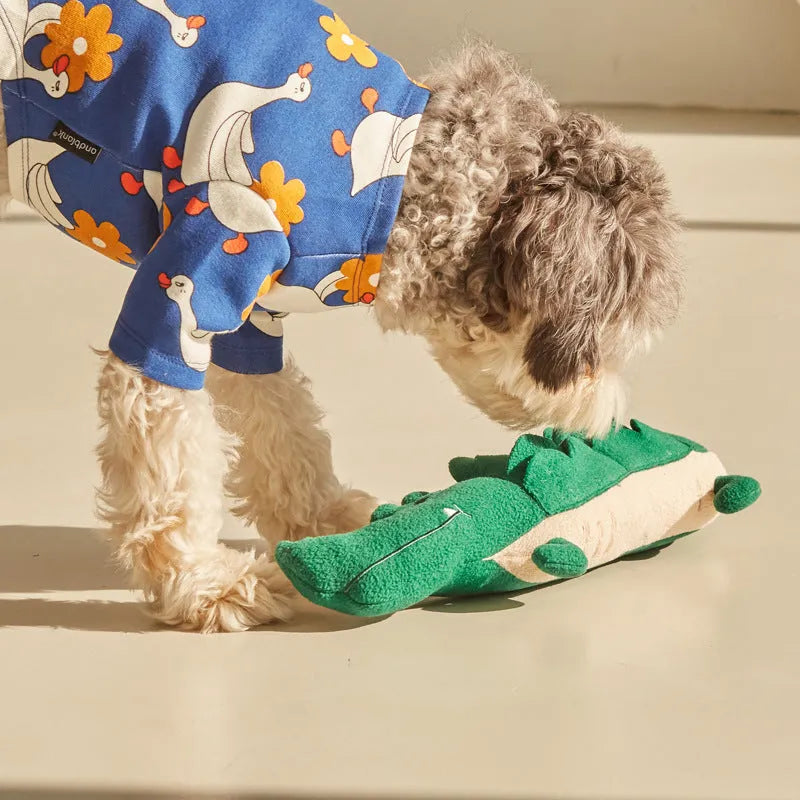 Green plush dog toy measuring 35cm long and 18cm wide for interactive pet play
