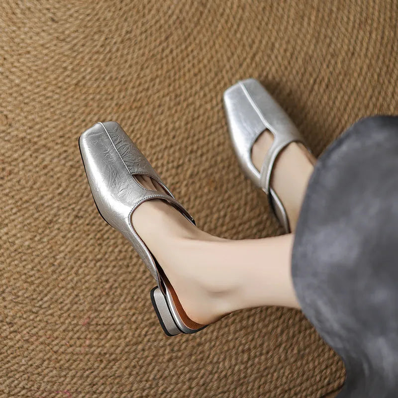Pair of low heel outdoor slippers with a square toe in a solid colour