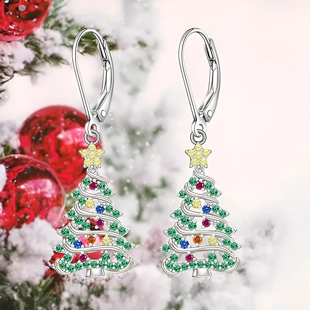 A pair of star-shaped Christmas tree earrings for women in a white gold colour.