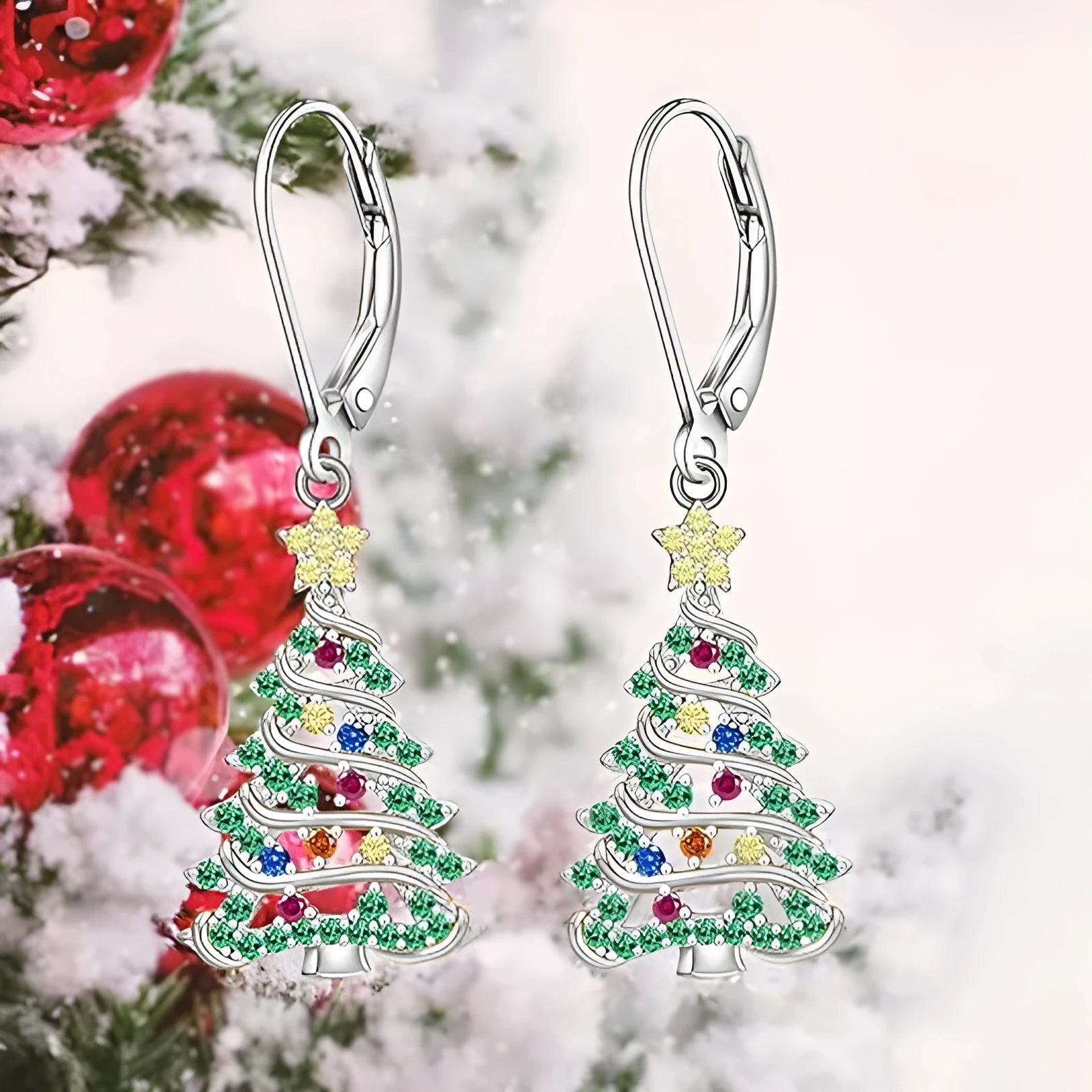 A pair of star-shaped Christmas tree earrings for women in a white gold colour.