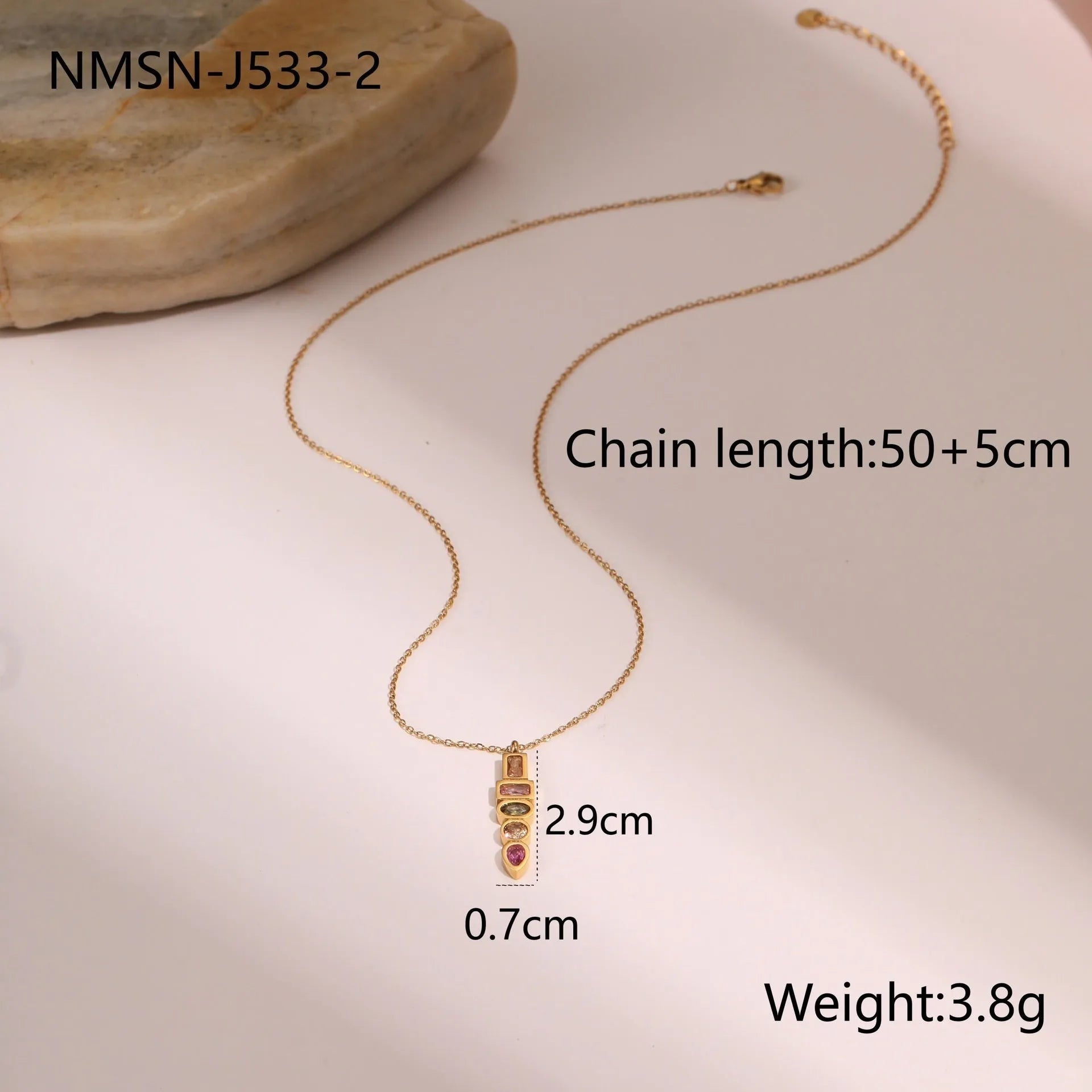 Geometric gold plated jewellery set showing necklace, ring, and earrings with chain design elements