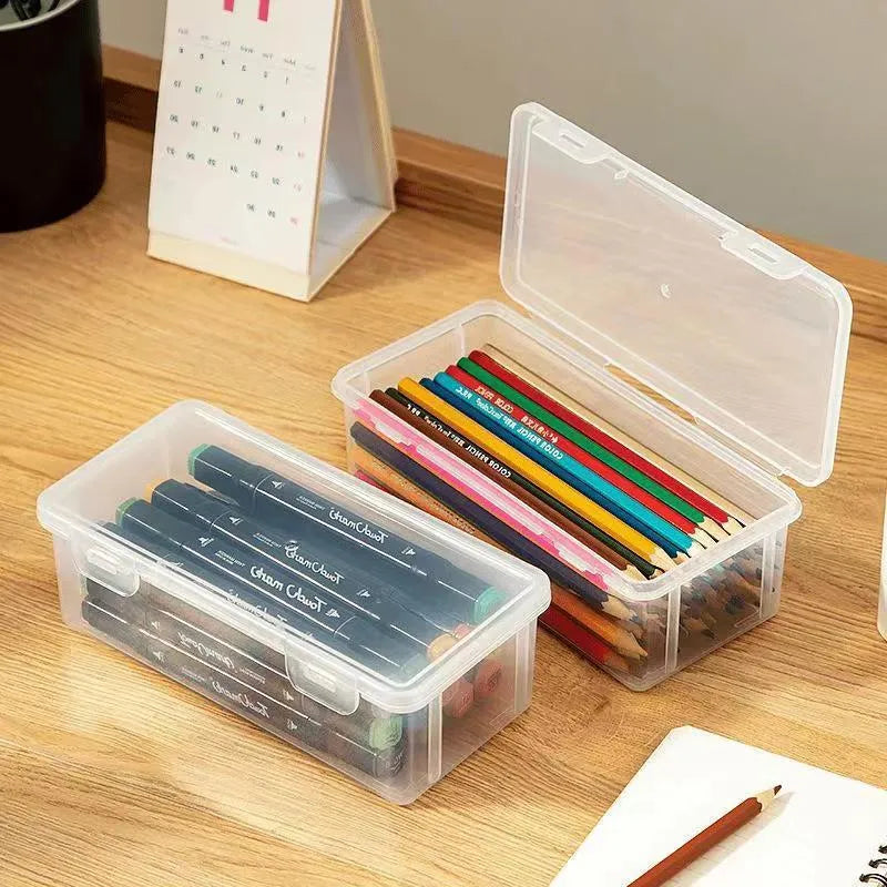 Transparent PP plastic stationery storage box with pencils and art supplies visible inside