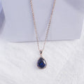 Rose gold geometric drop necklace with rhinestone details in pink colour option