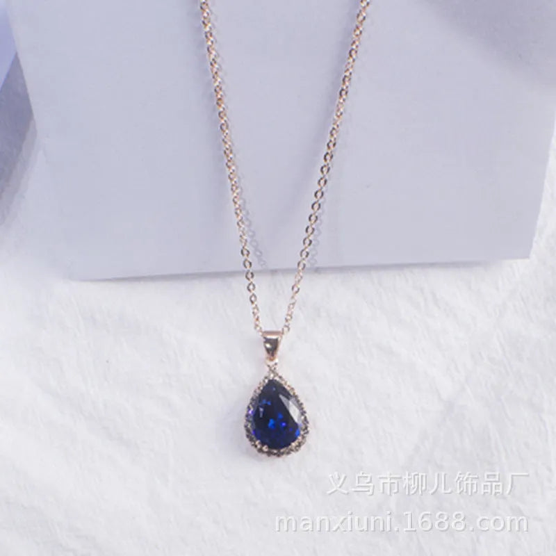 Rose gold geometric drop necklace with rhinestone details in pink colour option
