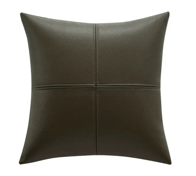 Simple solid colour cowhide leather pillow cover on a sofa, shown in a beige white colour.