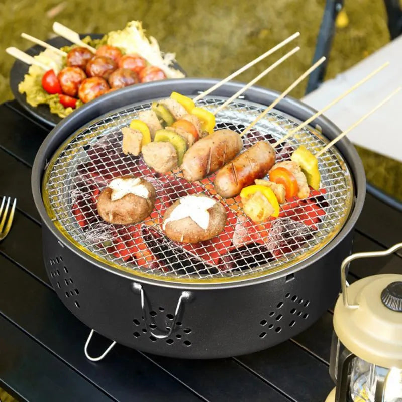 Portable stainless steel charcoal barbecue grill with detachable legs and storage bag
