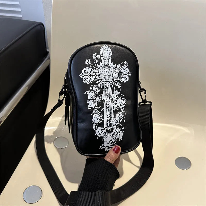 Black mini crossbody phone bag with Halloween graffiti print showing pumpkins, ghosts and bats
