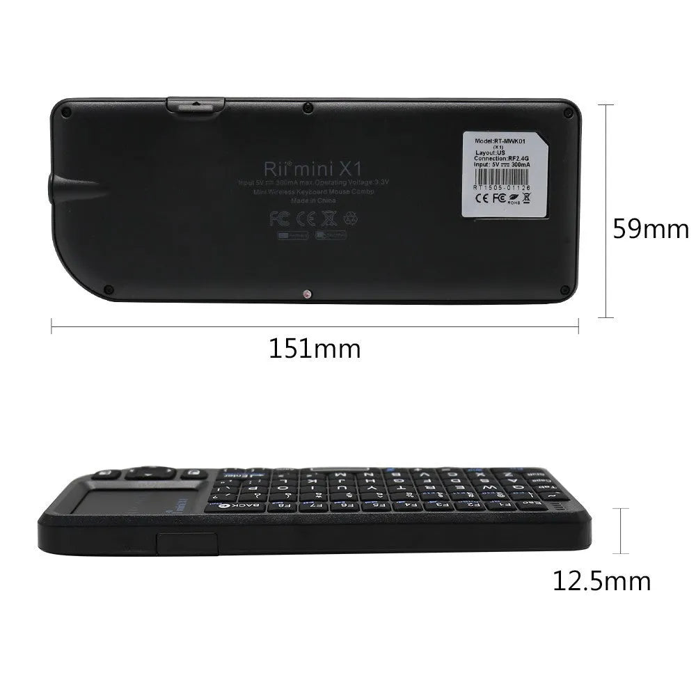 Black wireless mini keyboard with built-in trackpad and 2.4GHz receiver on a desk