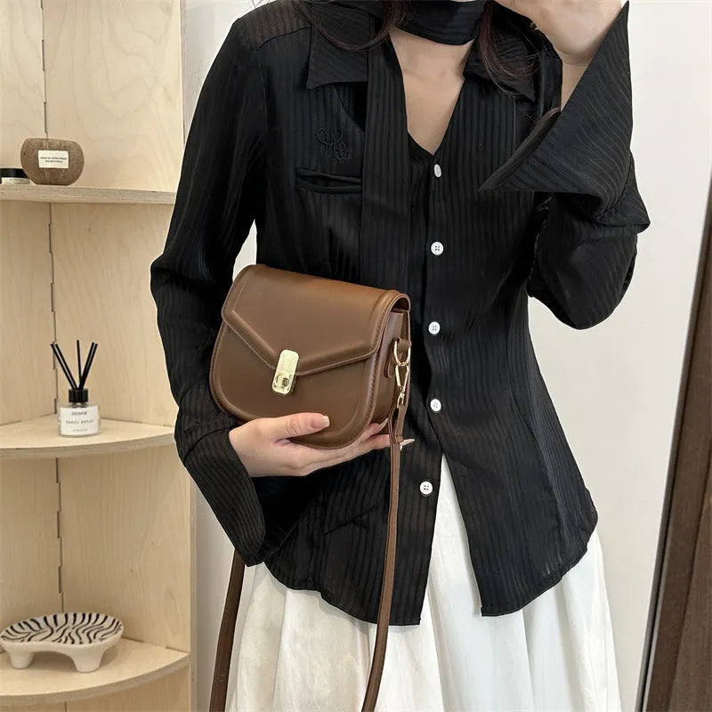 Soft PU leather clamshell messenger bag in horizontal square design shown in available colours.