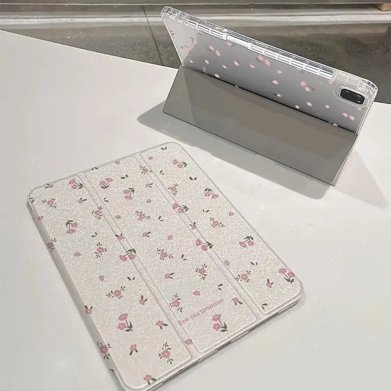 Transparent iPad case with floral cartoon pattern showing tri-fold stand position
