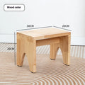 Solid wood shoe changing stool with a distressed rustic finish and sturdy bracket legs.