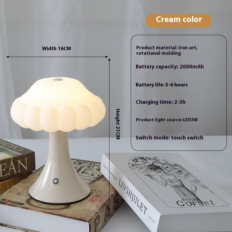 Small mushroom-shaped touch night lamp in wood grain finish on a wooden table.