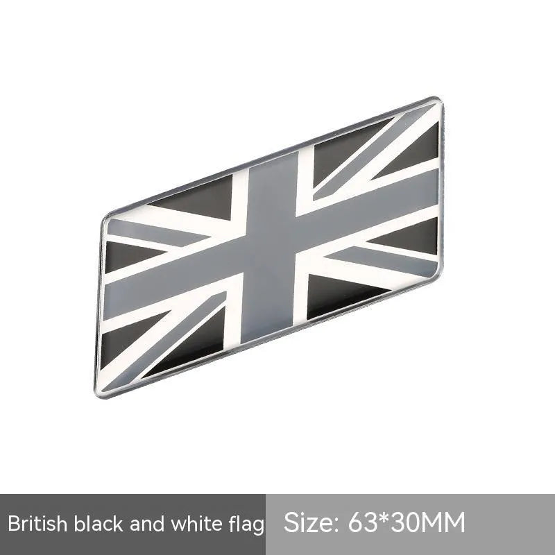 Aluminium parallelogram car sticker showing a national flag design, measuring 6.3 by 3 centimetres.