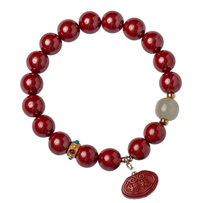 Natural cinnabar bracelet with Ping An Fu Lu design on 8mm or 10mm beads.