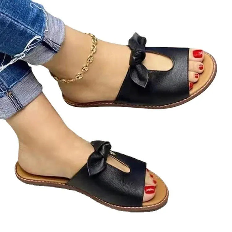 Ladies casual sandals with bow detail and fish mouth style in black, pink, and gold colours